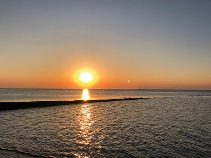 Der Sonnenuntergang über der Nordsee