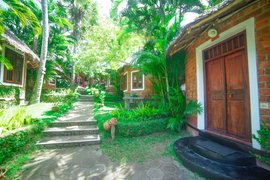 Das Garten Cottage liegt inmitten der grünen Anlage