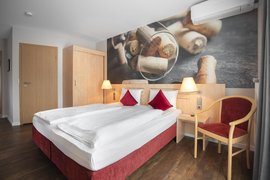 Das gemütlich eingerichtete Zimmer bietet Ihnen einen Rückzugsort zum Wohlfühlen 
